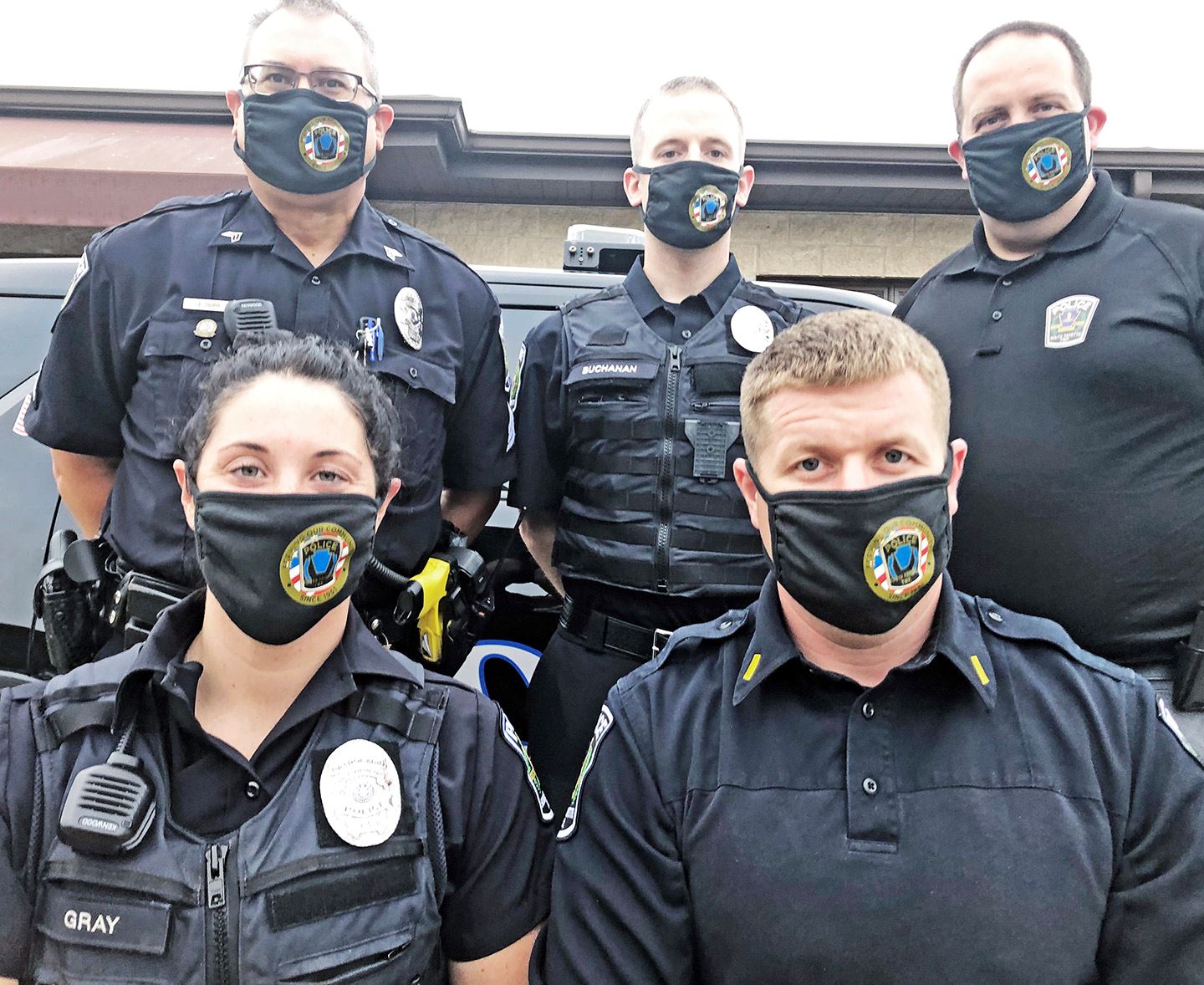 Officers wearing masks
