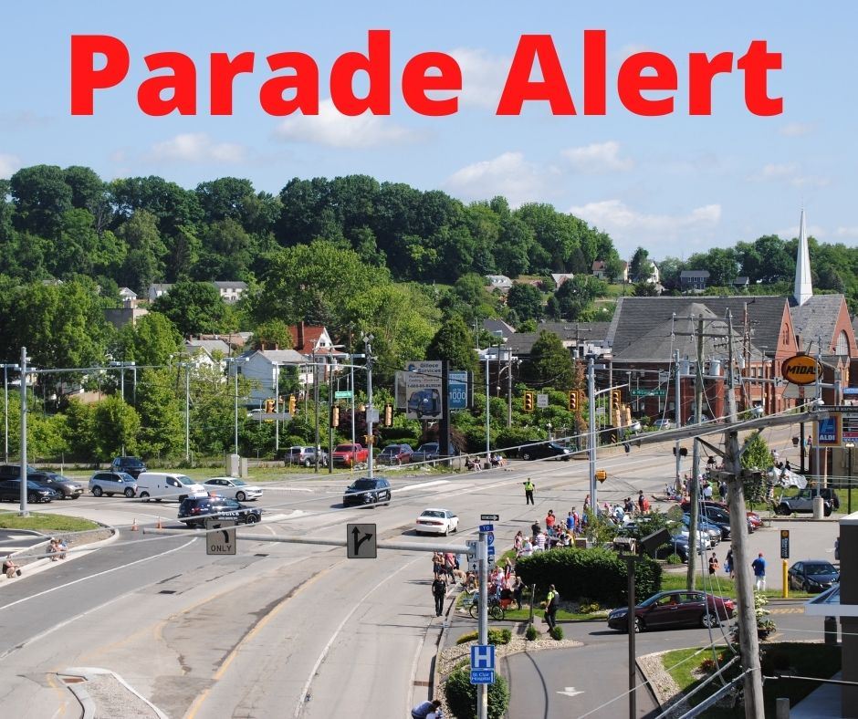 Parade Alert text with photo of Washington Pike before parade