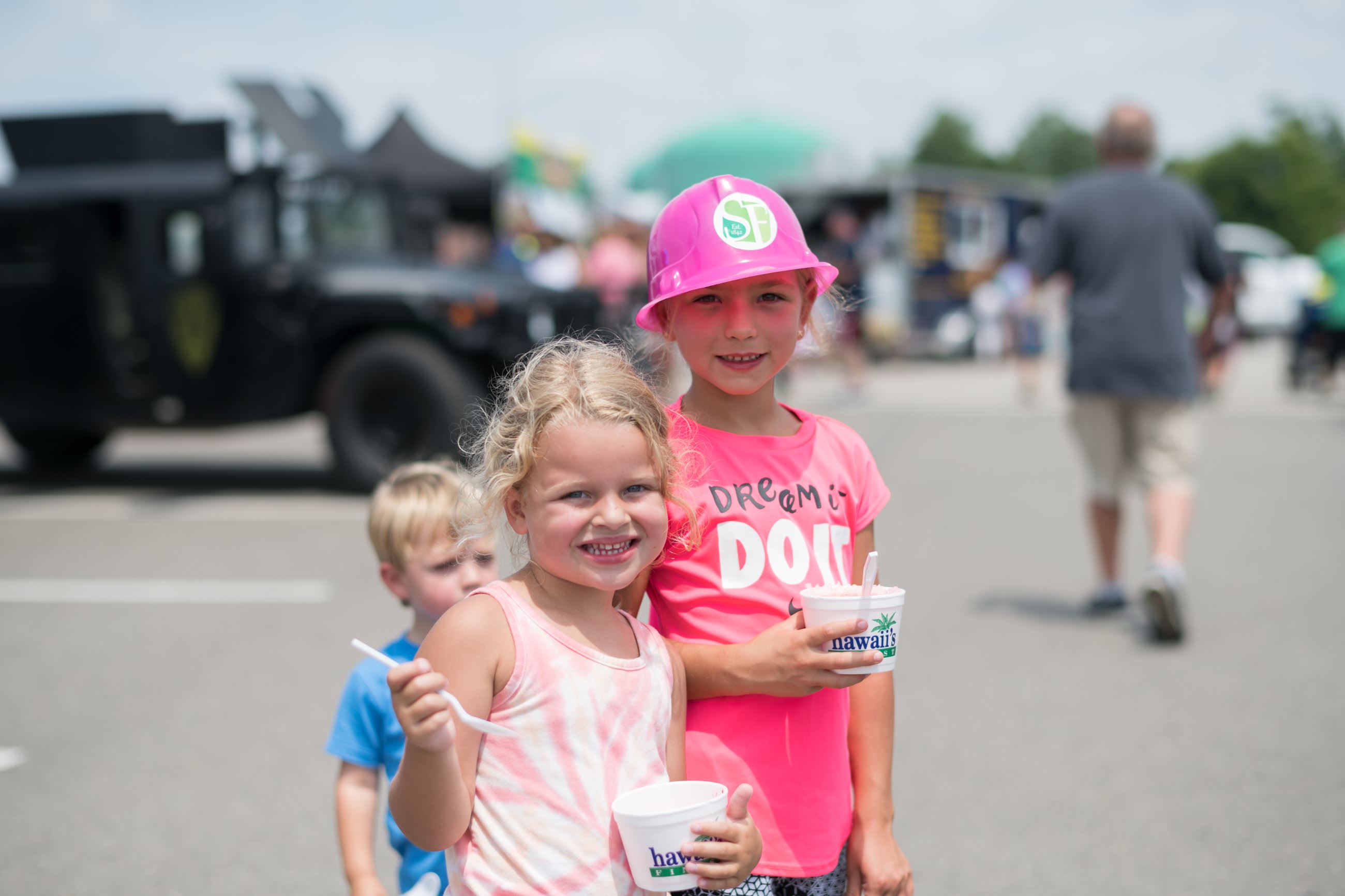 children with ice cream and toy hard hats