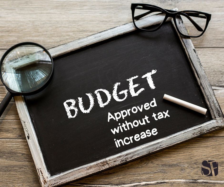 Budget approved without tax increase on chalkboard